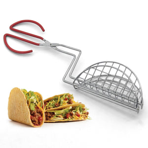 A pair of silver-colored taco shell tongs with red handles, displayed alongside two fried tacos with toppings.